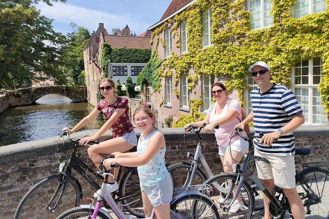 Bruges by bike with friends and family! - Poertoren Tower and Bruges on the Ramparts