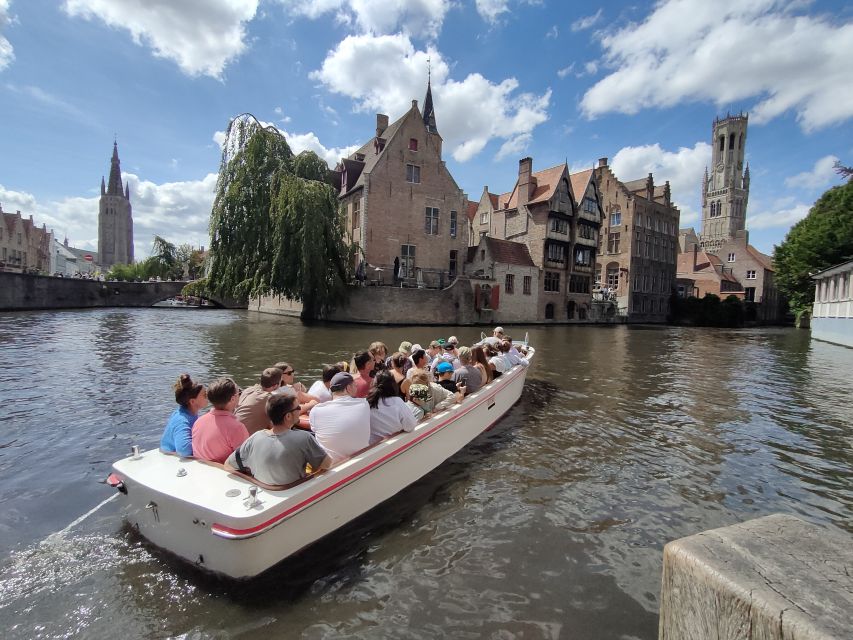 Bruges: Small Group Boat Cruise and Guided Walking Tour - The Basilica of the Holy Blood and the courthouse statues