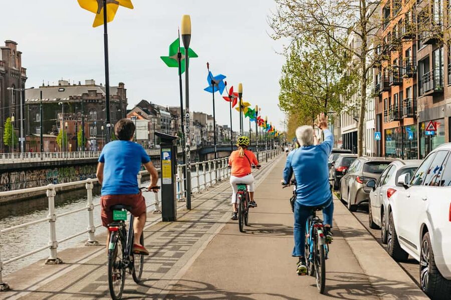 Brussels: City Highlights and Hidden Gems Bike Tour - Leaving the postcard center