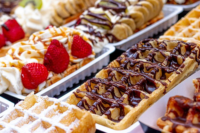 Brussels Walking Tour with Waffle Tasting: History and Delights - Walking Conditions, Languages, and Timing