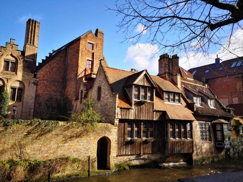 From Amsterdam: Bruges Day Trip in Spanish with Boat Option - Burg Square, Grote Markt, and the Belfort