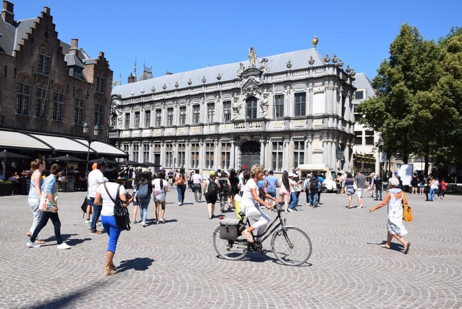 From Brussels: Bruges Private Tour - Entering Bruges through the old city wall park