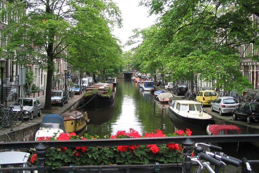 From Brussels: Cheese, Clogs & Windmills Amsterdam Day Trip - Arriving in Amsterdam by panoramic coach